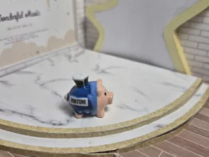 ST8H2 FEVE A L'UNITE COCHON TIRELIRE