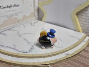 ST8H2 FEVE A L'UNITE COCHON TIRELIRE